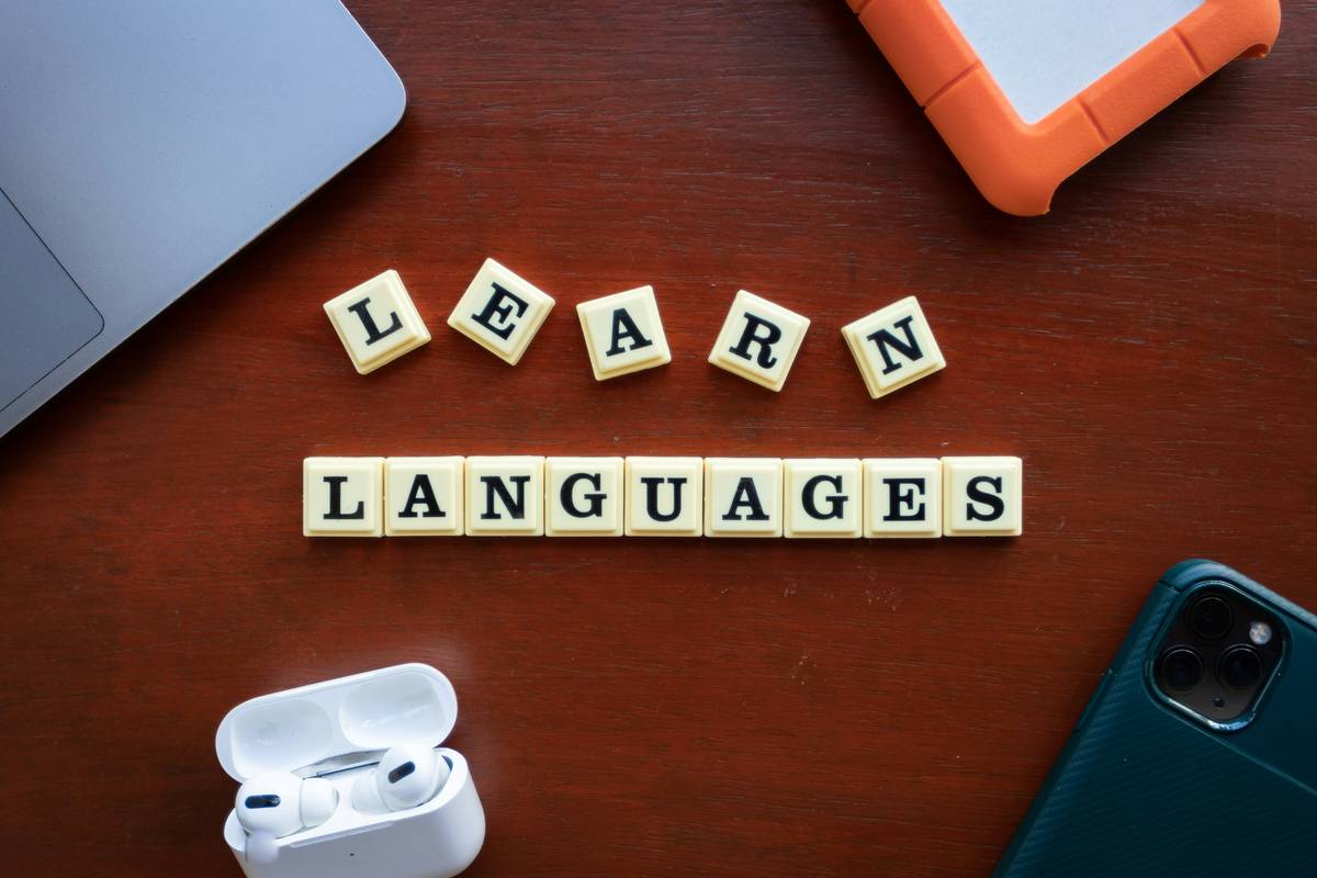 what is translation services illustrated as a bridge connecting two medical textbooks labeled 'English' and 'German', with precise anatomical terms visible on both sides